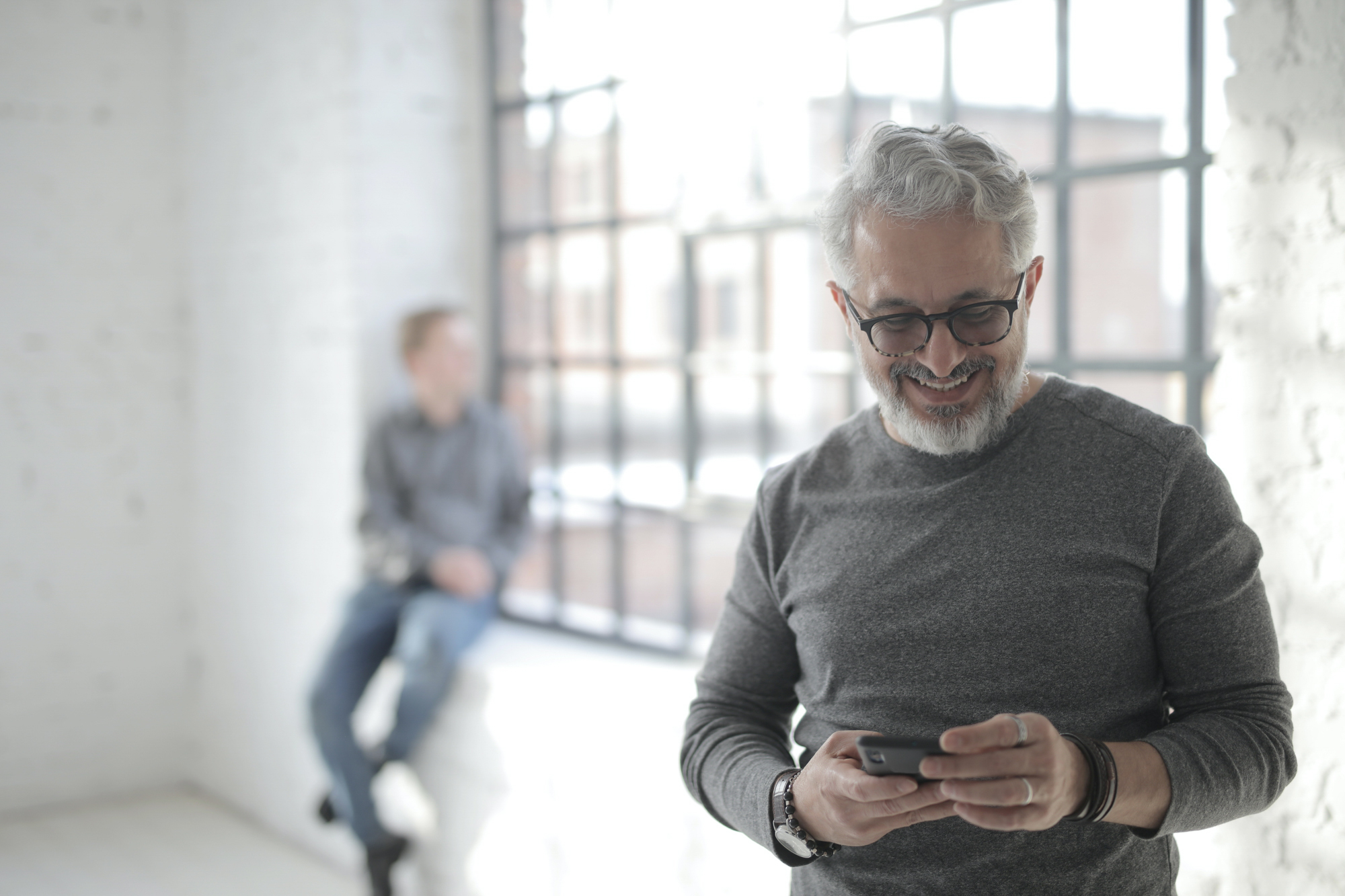 A patient looks down at his phone and ignores his partner, which goes against our recommended everyday habits to boost your sex life.